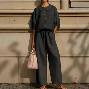 Elegant black cotton linen two-piece set with lantern sleeve shirt and wide-leg pants