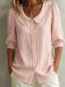 Detailed close-up view of a pink and white striped shirt featuring a stylish Peter Pan collar