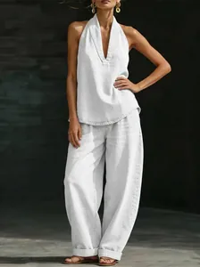 Elegant white denim set featuring a halter top and wide-leg trousers for a chic look