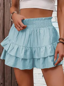Detailed close-up of a light blue smocked waist ruffled skort with a layered design