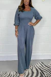 Summer casual solid color smocked waist jumpsuit with puff sleeves and wide leg design