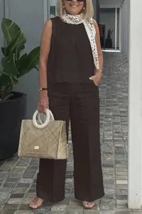 Full body view of a stylish sleeveless cotton linen two-piece wide-leg set in brown