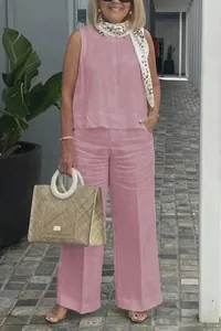 Full view of pink cotton linen sleeveless tank top and wide leg pants set on model
