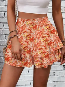 Detailed macro view of the vibrant orange floral print on this tiered summer mini skort