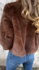 Close-up back view of a plush brown faux fur jacket showcasing soft textured finish