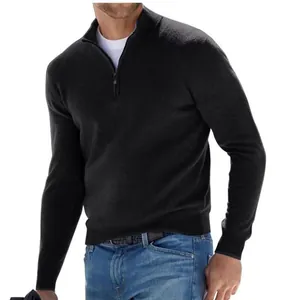 Detail shot of a black men's quarter-zip winter long-sleeve polo sweater with collar