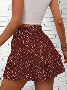 Back view of stylish burgundy polka dot tiered ruffled mini skort featuring elastic waist detail
