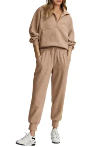 Two-piece ribbed half-zip sweatshirt and jogger lounge set in tan displayed on model