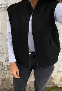 Detail of casual black knit zip-up vest for women with a stand collar and loose fit design