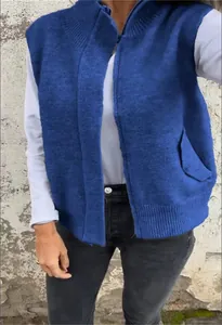 Detailed view of women's blue knitted zip-up vest with ribbed collar and pockets