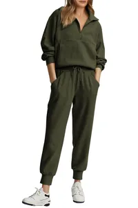 Two-piece dark olive green ribbed lounge set featuring half-zip pullover and joggers