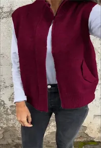 Detailed close-up of a wine red knitted vest with a stand collar and zipper for autumn
