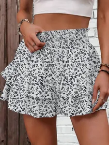 Detail view of a white floral tiered ruffle skort featuring a high elastic waist design