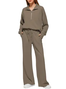 Front view of brown two-piece lounge set featuring half-zip top and wide-leg sweatpants