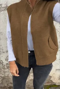 Detailed view of women's brown knit sweater vest with zipper and ribbed collar