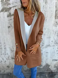Detail of woman in brown contrast hooded cardigan with grey lining and cuff buttons.