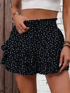 Detail view of women's polka dot tiered ruffle shorts with smocked waist