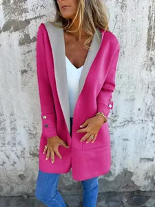 Close-up of pink contrast hooded cardigan featuring grey lining and gold buttons