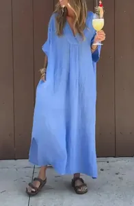 Loose light blue washed cotton V-neck maxi dress with leisure resort style silhouette