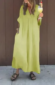 Woman wearing a bright lime green washed cotton V-neck maxi dress for summer leisure
