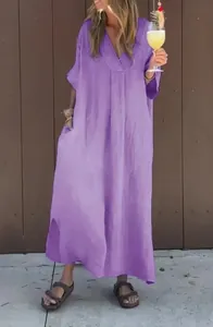 Full length view of a purple washed cotton V-neck casual maxi dress in a lifestyle setting