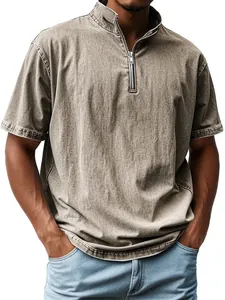 Detail of washed denim-like fabric on men's vintage quarter-zip short sleeve polo shirt.