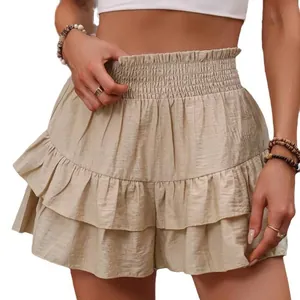 Chic beige high-waisted tiered ruffle shorts with a comfortable smocked waistband