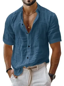 Close-up of a blue short-sleeved linen shirt with textured fabric and buttons