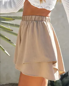 Close-up detail of khaki layered culottes featuring a comfortable elastic waist design