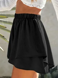 Close-up of black tiered summer culottes with elastic waistband and ruffled hem