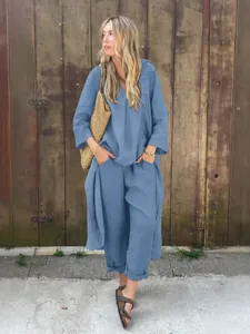 Elegant blauw katoen-linnen damesensemble met shirt met lange mouwen en losse lange broek