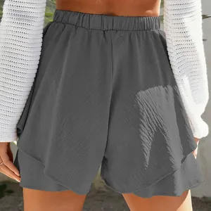Close-up back view of grey high-waisted ruffled casual skort with elastic waist