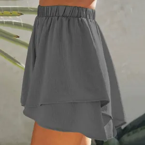 Detailed side view of grey layered skort with elastic waistband and soft texture