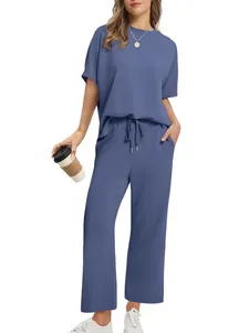Casual women's two-piece set featuring a dusty blue short sleeve top and wide-leg pants