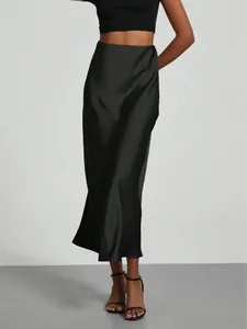 Detail view of elegant black satin midi skirt with a high waist and smooth finish