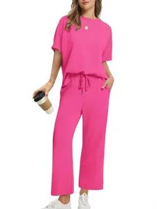 Women's bright pink 2-piece lounge set with a short sleeve top and wide leg pants