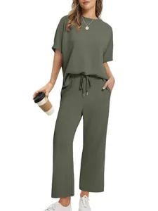 Women's olive green two-piece loungewear set with short sleeve top and wide leg pants