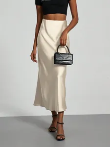 Elegant high-waisted satin midi skirt in champagne with a smooth glossy finish