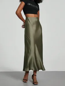 Close-up detail of an elegant olive green high waist satin midi skirt with glossy texture