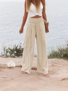 Pantalon large beige élégant à taille haute pour un look de plage décontracté d'été