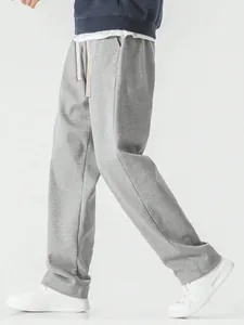 Side view of grey loose-fit men's sweatpants showing a relaxed drape and comfortable fit
