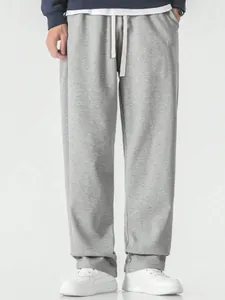 Loose-fit gray men's sports casual sweatpants with adjustable drawstring waist.