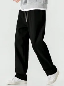 Mens loose black wide-leg floor-length trousers in relaxed American street style design
