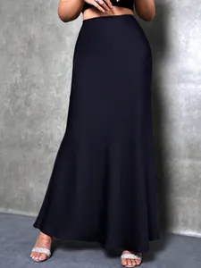 Elegant black satin high-waisted maxi skirt with a graceful drape shown on a model