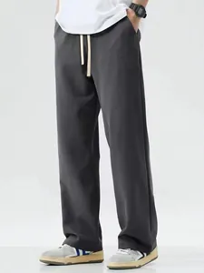 Detailed shot of men's loose fit charcoal gray wide-leg casual pants for everyday styling