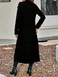 Back view of elegant full-length black woolen coat featuring lapel collar and classic silhouette