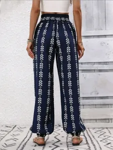 Back view detail of navy blue boho lantern pants with white geometric tree pattern