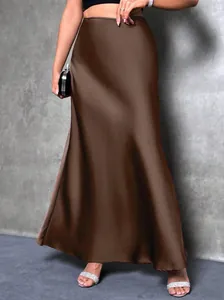 Detailed view of the elegant chocolate brown satin high-waist skirt with a smooth drape.