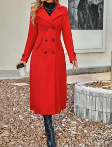 Detailed view of an elegant red double-breasted wool coat featuring prominent black buttons.