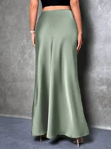 Back view of elegant sage green satin high-waisted maxi skirt for women.